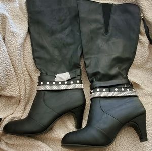 Black knee high heeled boots